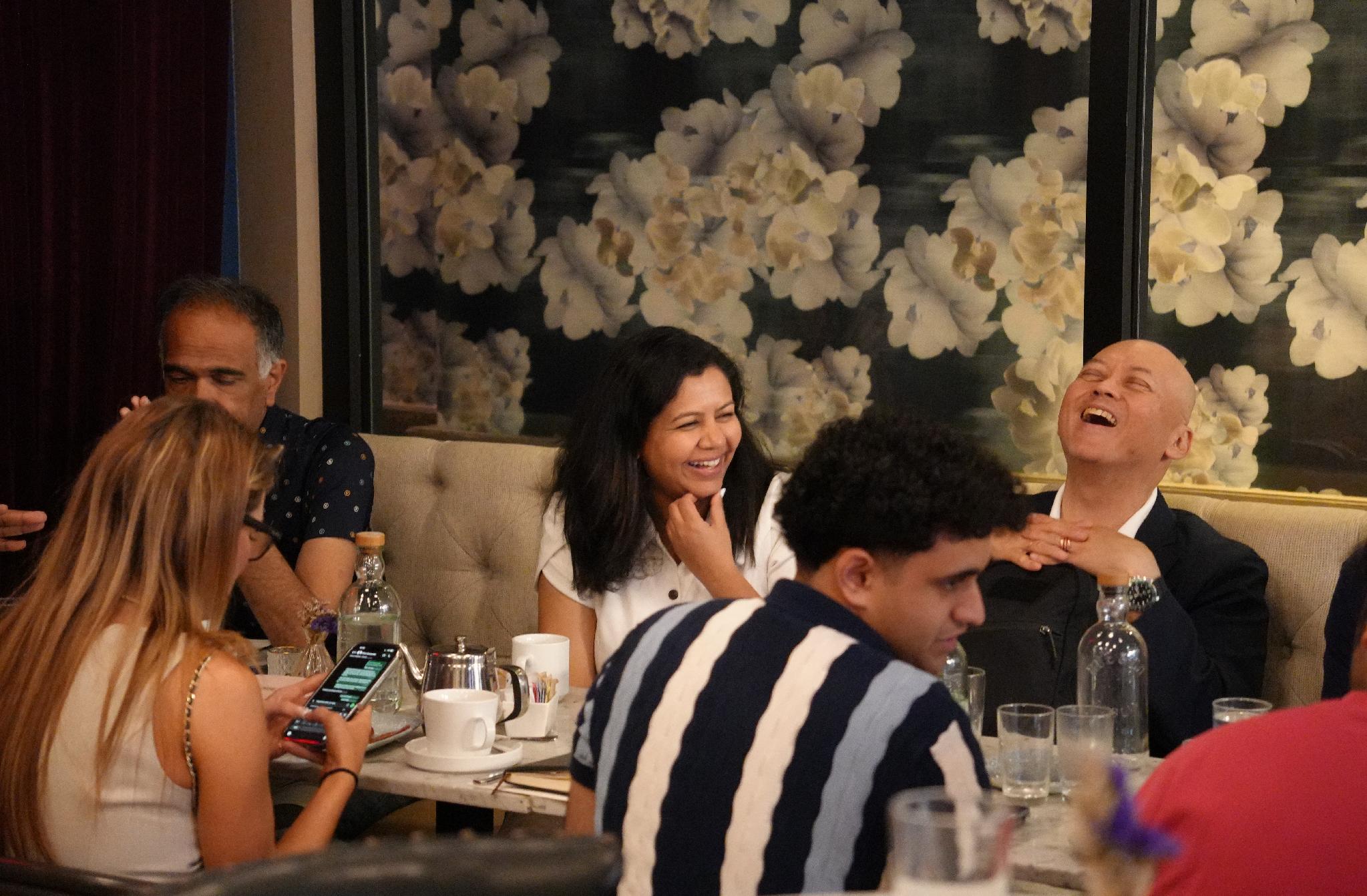 Guests talking in a warm lounge at a VIP tech evening